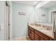 Bright bathroom features a double sink vanity with granite counters, tile flooring, and a modern design at 3387 Tawny Grove Pl, Lakeland, FL 33811