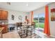Dining area features a dining table and views to the lake at 3387 Tawny Grove Pl, Lakeland, FL 33811