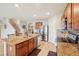 Spacious kitchen with stainless steel appliances, granite countertops, and tile flooring at 3387 Tawny Grove Pl, Lakeland, FL 33811