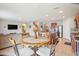 Open concept kitchen and living area with tile flooring throughout at 3387 Tawny Grove Pl, Lakeland, FL 33811