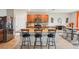 Kitchen island with granite countertops and stainless steel appliances at 3387 Tawny Grove Pl, Lakeland, FL 33811