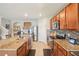 Large kitchen featuring stainless steel appliances, granite countertops, and tile flooring at 3387 Tawny Grove Pl, Lakeland, FL 33811