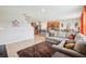 Inviting living room featuring an open layout, cozy furniture, and seamless access to the kitchen at 3387 Tawny Grove Pl, Lakeland, FL 33811