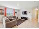 Bright living room featuring a comfortable seating area and scenic views at 3387 Tawny Grove Pl, Lakeland, FL 33811