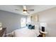 Stylish bedroom featuring a comfortable bed, chic decor, and plenty of natural light at 4747 Golden Knight Blvd, Kissimmee, FL 34746