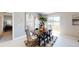 Open dining room with sliding glass doors that provide plenty of natural light and serene water views at 4747 Golden Knight Blvd, Kissimmee, FL 34746