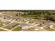 Wide aerial shot of a residential neighborhood with charming homes, street access and local water and commercial resources at 726 Eagle Landing Blvd, Winter Haven, FL 33880