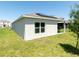 The backyard offers a covered patio with outdoor seating and solar panels on the roof at 726 Eagle Landing Blvd, Winter Haven, FL 33880