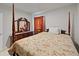 Warm bedroom with a four poster bed, floral bedding, and coordinated dresser at 726 Eagle Landing Blvd, Winter Haven, FL 33880
