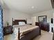 Cozy bedroom with a plush bed, elegant furnishings, soft carpet, and a well-lit ambiance at 726 Eagle Landing Blvd, Winter Haven, FL 33880