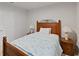 Cozy bedroom with a light wood frame bed, matching bedside tables, and soft decor at 726 Eagle Landing Blvd, Winter Haven, FL 33880