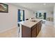 Open concept kitchen with large island and sink offers a view into the living room at 726 Eagle Landing Blvd, Winter Haven, FL 33880