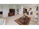 Open-concept living room with stylish furniture, a kitchen and dining area in the background at 726 Eagle Landing Blvd, Winter Haven, FL 33880