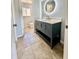 Modern bathroom with a new vanity, stylish mirror, and decorative finishes at 3465 Peacock Ln, Mulberry, FL 33860
