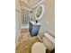 Modern bathroom featuring a shower with decorative tiling, vanity, and toilet at 3465 Peacock Ln, Mulberry, FL 33860