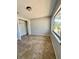 Neutral bedroom featuring tiled floors, open closet with a window for natural light at 3465 Peacock Ln, Mulberry, FL 33860