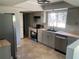 The newly remodeled kitchen is sure to please with its modern cabinets, butcher block counters and stainless appliances at 3465 Peacock Ln, Mulberry, FL 33860