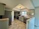 The newly remodeled kitchen is sure to please with its modern cabinets, butcher block counters and stainless appliances at 3465 Peacock Ln, Mulberry, FL 33860