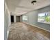 Bright living room with tile floors and large windows offering natural light at 3465 Peacock Ln, Mulberry, FL 33860