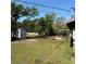Large backyard area with storage shed and outdoor deck space perfect for entertaining and relaxing at 3640 Chart Prine Rd, Lakeland, FL 33810