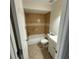 Bathroom featuring a tiled shower-tub combo, toilet, and vanity, complete with tile floors and neutral tones at 3640 Chart Prine Rd, Lakeland, FL 33810