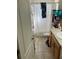 Bright bathroom featuring a shower, toilet, and vanity with a light-colored countertop and wooden cabinets at 4707 Melody Ln, Lakeland, FL 33805