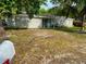 Charming single-story home with mature trees in a well-maintained front yard at 4707 Melody Ln, Lakeland, FL 33805