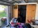 Garage with wooden doors to another room at 4707 Melody Ln, Lakeland, FL 33805