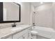 Bathroom with a tub, shower, and sink with granite countertops at 7700 Somersworth Dr, Kissimmee, FL 34747