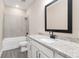 Bathroom with shower over tub and granite countertop at 7733 Somersworth Dr, Kissimmee, FL 34747