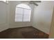 Bedroom with carpet flooring and large windows at 1184 Athlone Way, Ormond Beach, FL 32174
