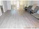 Open living room with hard surface floors and sliding glass doors to a screened patio at 1184 Athlone Way, Ormond Beach, FL 32174