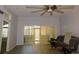 Bright living room with hard surface flooring and access to a screened patio through sliding glass doors at 1184 Athlone Way, Ormond Beach, FL 32174