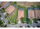 Birds-eye view of the home with a lovely lawn, neighboring homes, and community at 1401 Wexford Way, Davenport, FL 33896