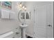Modern bathroom with single sink vanity and commode at 1401 Wexford Way, Davenport, FL 33896