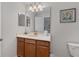 Bright bathroom with single sink vanity and commode at 1401 Wexford Way, Davenport, FL 33896