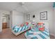 This bedroom is decorated with two twin beds and ocean-themed decor at 1401 Wexford Way, Davenport, FL 33896
