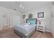 Comfortable bedroom with a neutral color scheme, ceiling fan, and access to the en-suite bathroom at 1401 Wexford Way, Davenport, FL 33896