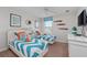 Charming bedroom with two twin beds and fun, colorful ocean themed decor at 1401 Wexford Way, Davenport, FL 33896