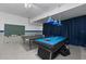 Spacious game room featuring ping pong and pool table at 1401 Wexford Way, Davenport, FL 33896