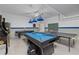 Large game room includes pool table, air hockey and ping pong at 1401 Wexford Way, Davenport, FL 33896