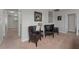 This hallway has three leather chairs and dark wood accents at 1401 Wexford Way, Davenport, FL 33896