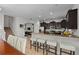 Open-concept kitchen with breakfast bar overlooking dining and living areas, perfect for entertaining at 1401 Wexford Way, Davenport, FL 33896