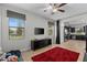 Inviting living room featuring a large window, tile flooring, and an entertainment center with a mounted TV at 1401 Wexford Way, Davenport, FL 33896
