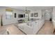 Inviting living room features natural light, neutral walls, a large sectional sofa and an open concept design at 1401 Wexford Way, Davenport, FL 33896