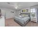 Large main bedroom featuring a king-size bed, bedside tables, closet, and natural light at 1401 Wexford Way, Davenport, FL 33896