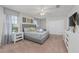 Spacious main bedroom featuring a king bed, ceiling fan, and plenty of natural light at 1401 Wexford Way, Davenport, FL 33896
