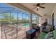 Spacious covered patio with outdoor furniture and views of the pool and lush landscaping at 1401 Wexford Way, Davenport, FL 33896