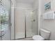 Modern shower with glass door, bright light and views to backyard at 1401 Wexford Way, Davenport, FL 33896