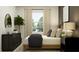 Bright bedroom showcasing a comfy bed, warm lighting, and stylish furnishings for a relaxing atmosphere at 1626 Teagan Ln, Winter Haven, FL 33884